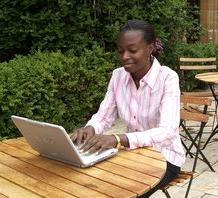 student using laptop outside