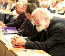 Dr Rowan Williams is amused by his introduction to the audience
