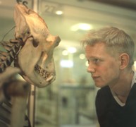 A visitor comes face to face with an exhibit at the Cole Museum