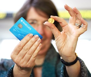 Rev Dr Margaret Yates, director of the new centre, with replica Roman coin and debit card