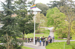 Raising a rainbow flag in support of IDAHO