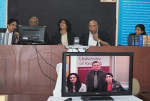 The judges in India with the Reading students taking part via video link
