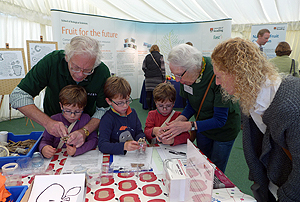 MERL volunteers assist children at the University's Berkshire Show stand