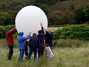Students launch a weather balloon on a previous fieldtrip