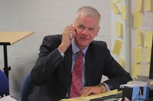 Sir David Bell helps man the Places Hotline
