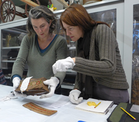 Basket makers examining rarely seen items from the MERL basket collection which will be on display in the new cases