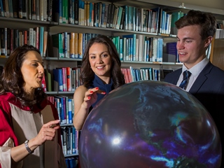 Laura Tobin - centre - with graduates in the Department of Meteorology