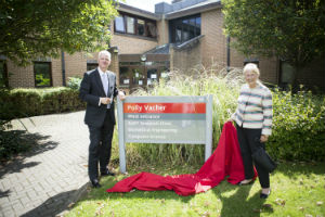 Polly Vacher and Sir David Bell, Vice-Chancellor of the University of Reading, unveil the sign outside the newly-renamed Polly Vacher building