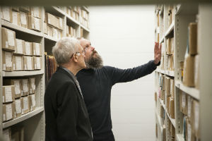 Dr Mark Nixon (R) shows James Kelman (L) around the Beckett Archive