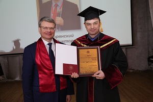 Vitaliy Khutoryanskiy receiving honorary degree from KSMU