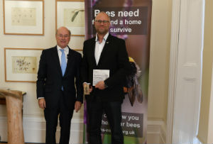 Professor Simon Potts receives the Defra Bees' Needs Champion Award from Lord Gardiner