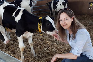 Dr Rebecca Meagher with a calf