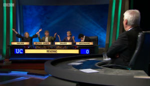 Jeremy Paxman looks on as the Reading team react to their final score