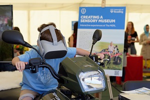 Young boy riding a virtual reality quad bike