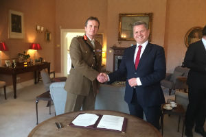 Major General Paul Nanson (L) and Professor Robert Van de Noort (R) sign the MoU