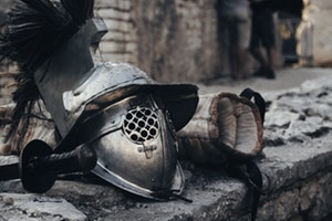 Spartan helmet next to sword