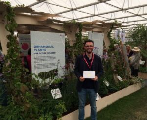 PhD student Tomos Jones with his Gold Medal