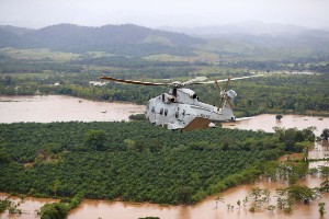 Merlin helicopters of 845 Naval Air Squadron fly sorties over flooded Honduras in the wake of Hurricane Eta and Iota