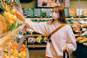 Woman wearing mask in supermarket