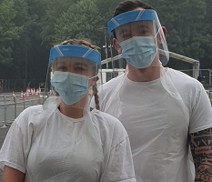 Ryan Swales and partner dressed in their PPE