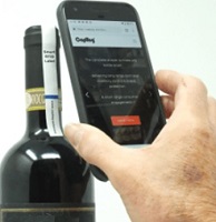 Smart phone reading a tag on a bottle of wine