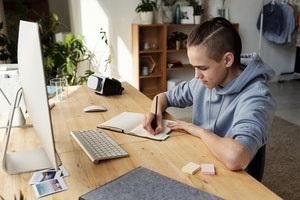 Teenage boy using a computer