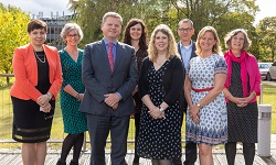 Colour photogrpah of vice chancellor Robert Van der Noort and winners of 2019 teachign and learngin awards