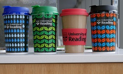 colour photograph of four university of reading reusable coffee cups