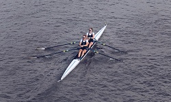 Colour photograph of University of reading rowers takign part in race on river thames