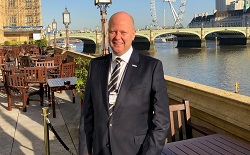 Colour portrait of Matthew White London eye in background